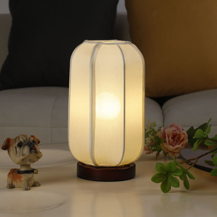 Traditional Chinese Fabric Cylinder Shade Table Lamp - 1-Light Wood Base for Bedroom 

Illuminate your space with this elegant Traditional Chinese table lamp. Featuring a unique fabric cylinder shade, it adds a touch of cultural charm to any bedroom. The