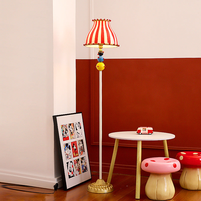Contemporary Circus Red & White Striped Glass Round Shade Floor Lamp - 1-Light Iron Design for Bedroom  

Illuminate your bedroom with this stylish contemporary floor lamp featuring a unique circus-inspired design. The vibrant red and white striped glass
