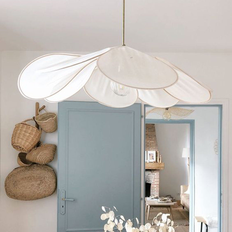 Contemporary Boho Metal Petal Pendant Light for Living Room  

Illuminate your living space with our Contemporary Boho Petal Fabric Metal Lampshade Pendant Light. This stylish 1-light fixture is perfect for adding a touch of bohemian flair to your decor.