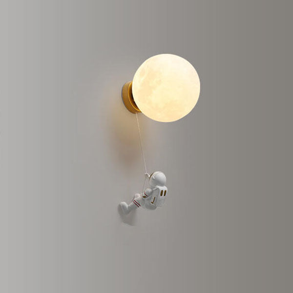 Contemporary Orb Astronaut Wall Sconce - Iron Resin 1-Light Lamp for Bedroom

Illuminate your space with the contemporary Orb Astronaut Wall Sconce, designed to bring a modern touch to your bedroom. This unique 1-light lamp features an elegant orb shape c