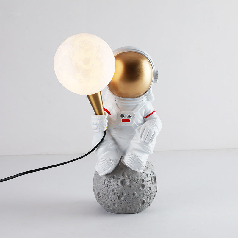Contemporary Astronaut Resin Table Lamp - 1-Light ABS Design for Bedroom 

Illuminate your space with this unique contemporary astronaut table lamp. Crafted from high-quality resin and ABS materials, it features a striking design that adds a playful yet m