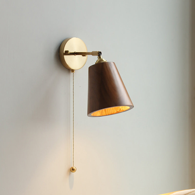 Contemporary Scandinavian Copper Wood 1-Light Wall Sconce for Bedroom  

Illuminate your bedroom with this stylish Scandinavian-inspired wall sconce. The unique round cone design combines warm copper and natural wood for a modern touch. This 1-light fixtu