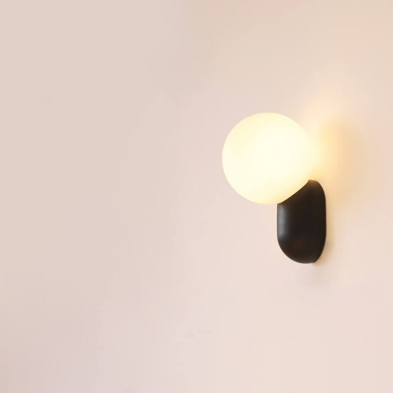 Macaron Cream Resin Glass Ball 1-Light Wall Sconce Lamp 

Illuminate your space with this stylish macaron cream wall sconce featuring a delightful resin glass ball design. Perfect for modern interiors, this 1-light lamp adds a touch of elegance to living