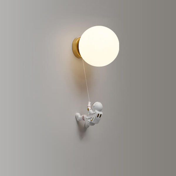 Contemporary Orb Astronaut Wall Sconce - Iron Resin 1-Light Lamp for Bedroom

Illuminate your space with the contemporary Orb Astronaut Wall Sconce, designed to bring a modern touch to your bedroom. This unique 1-light lamp features an elegant orb shape c