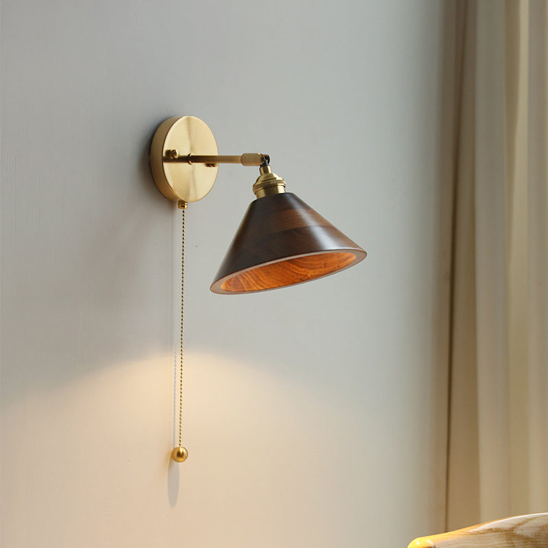 Contemporary Scandinavian Copper Wood 1-Light Wall Sconce for Bedroom  

Illuminate your bedroom with this stylish Scandinavian-inspired wall sconce. The unique round cone design combines warm copper and natural wood for a modern touch. This 1-light fixtu