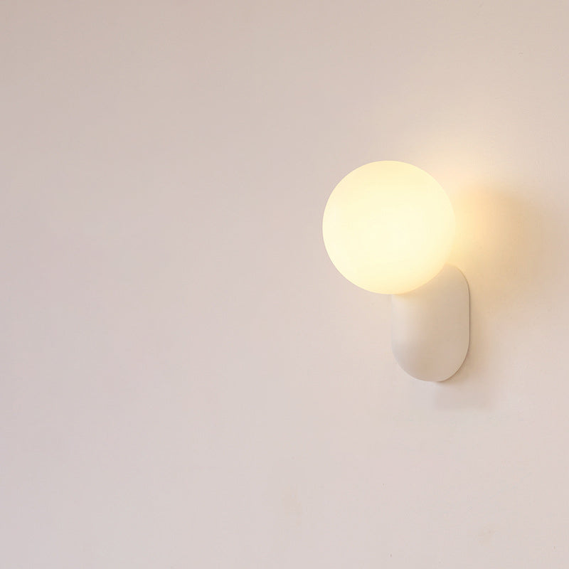 Macaron Cream Resin Glass Ball 1-Light Wall Sconce Lamp 

Illuminate your space with this stylish macaron cream wall sconce featuring a delightful resin glass ball design. Perfect for modern interiors, this 1-light lamp adds a touch of elegance to living