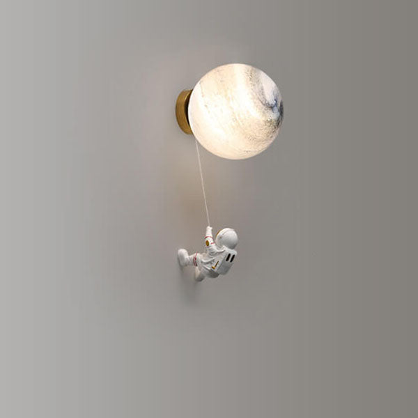 Contemporary Orb Astronaut Wall Sconce - Iron Resin 1-Light Lamp for Bedroom

Illuminate your space with the contemporary Orb Astronaut Wall Sconce, designed to bring a modern touch to your bedroom. This unique 1-light lamp features an elegant orb shape c