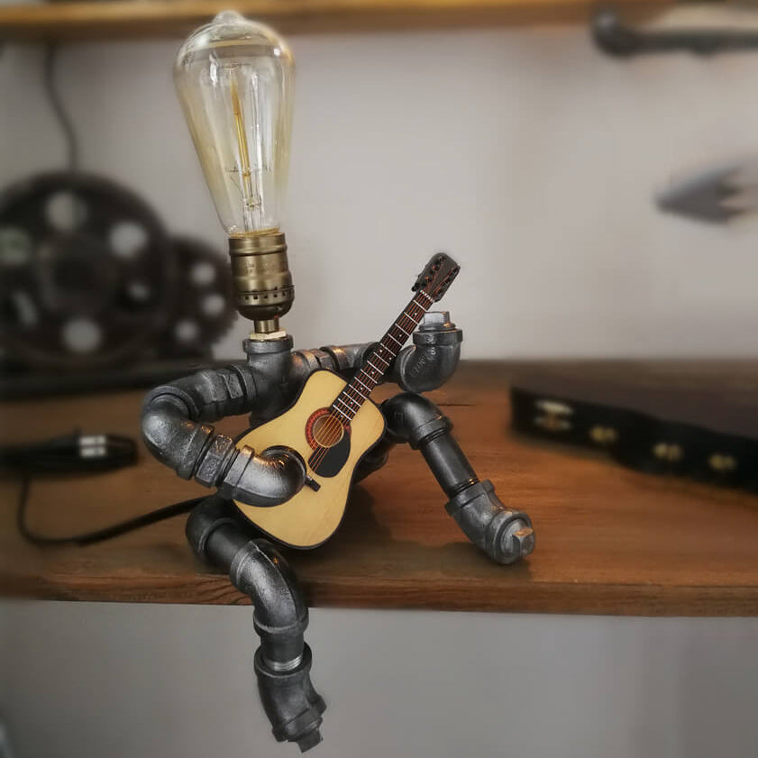 Industrial Plumbing Guitar Robot 1-Light Table Lamp | Unique LED Lighting | Modern Industrial Home Decor | Music-Themed Desk Lamp | Vintage Style Guitar Design | Creative Lighting Solution | Industrial Pipe Lamp | Adjustable Guitar Stand Base | Decorative