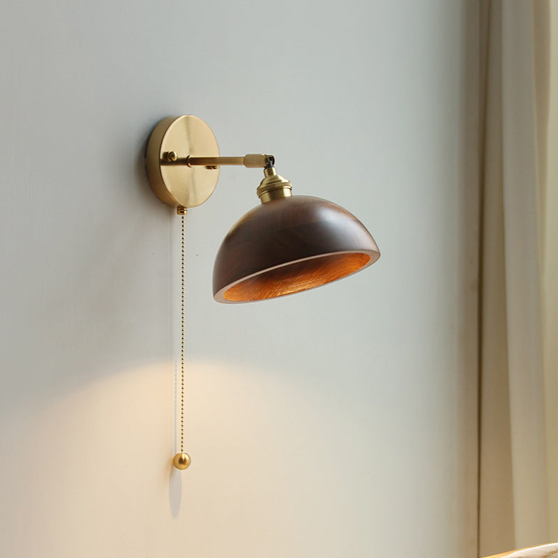Contemporary Scandinavian Copper Wood 1-Light Wall Sconce for Bedroom  

Illuminate your bedroom with this stylish Scandinavian-inspired wall sconce. The unique round cone design combines warm copper and natural wood for a modern touch. This 1-light fixtu