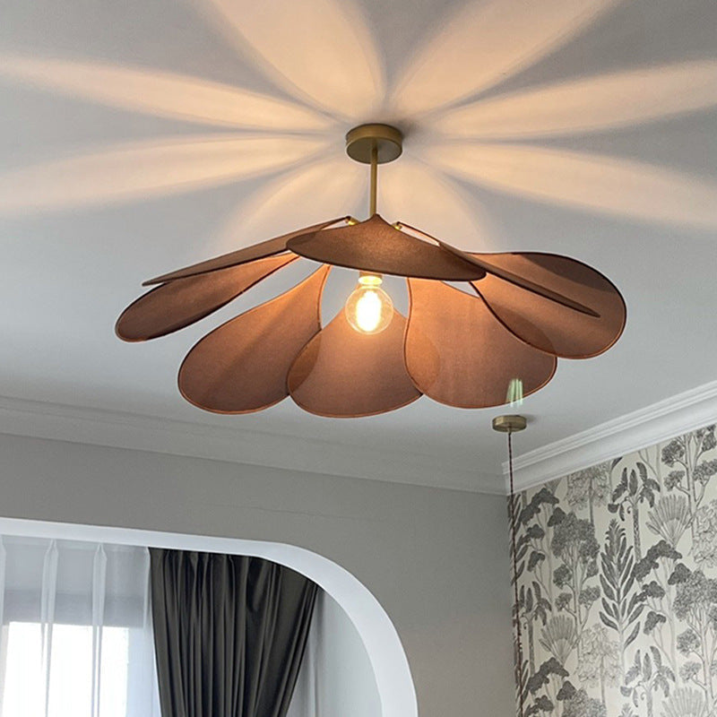 Contemporary Boho Metal Petal Pendant Light for Living Room  

Illuminate your living space with our Contemporary Boho Petal Fabric Metal Lampshade Pendant Light. This stylish 1-light fixture is perfect for adding a touch of bohemian flair to your decor.