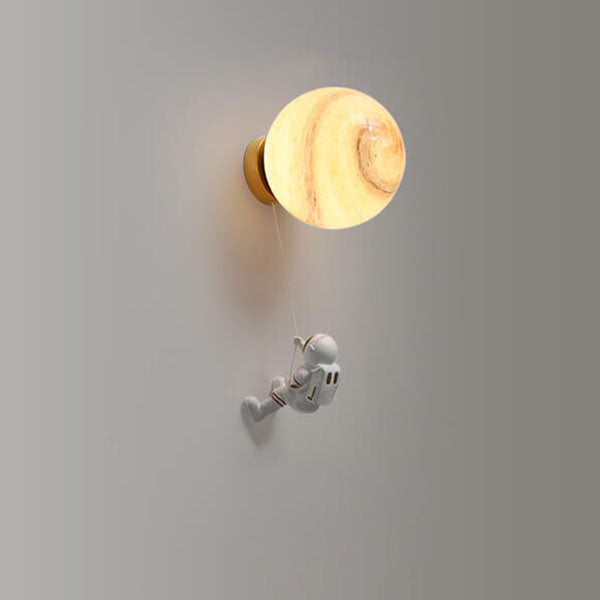 Contemporary Orb Astronaut Wall Sconce - Iron Resin 1-Light Lamp for Bedroom

Illuminate your space with the contemporary Orb Astronaut Wall Sconce, designed to bring a modern touch to your bedroom. This unique 1-light lamp features an elegant orb shape c