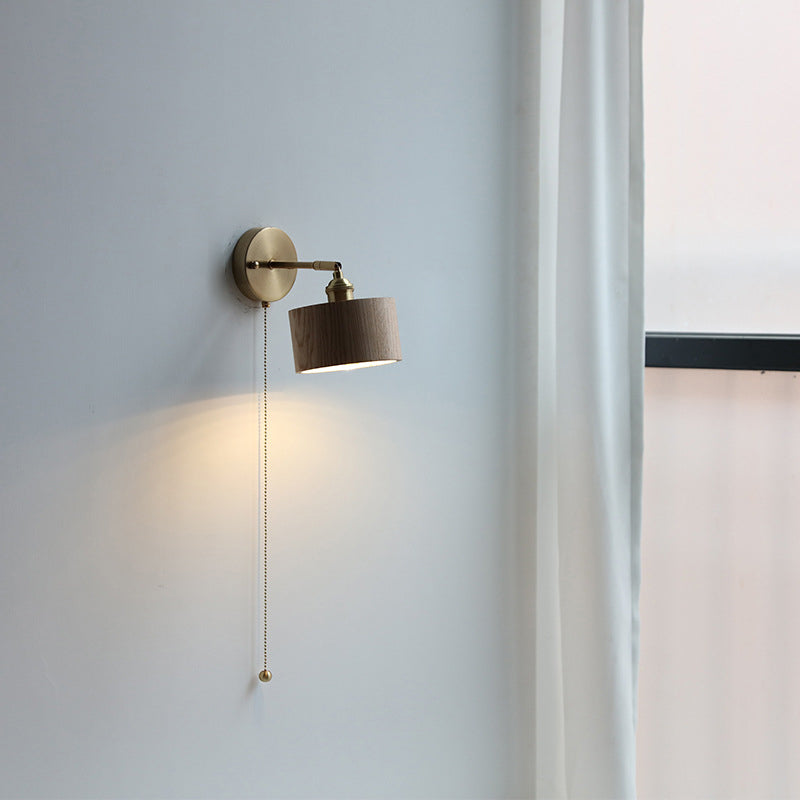 Contemporary Scandinavian Copper Wood 1-Light Wall Sconce for Bedroom  

Illuminate your bedroom with this stylish Scandinavian-inspired wall sconce. The unique round cone design combines warm copper and natural wood for a modern touch. This 1-light fixtu