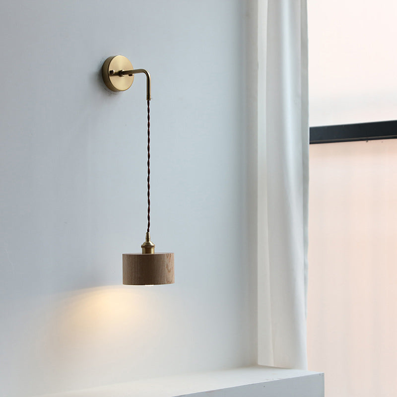 Contemporary Scandinavian Copper Wood 1-Light Wall Sconce for Bedroom  

Illuminate your bedroom with this stylish Scandinavian-inspired wall sconce. The unique round cone design combines warm copper and natural wood for a modern touch. This 1-light fixtu