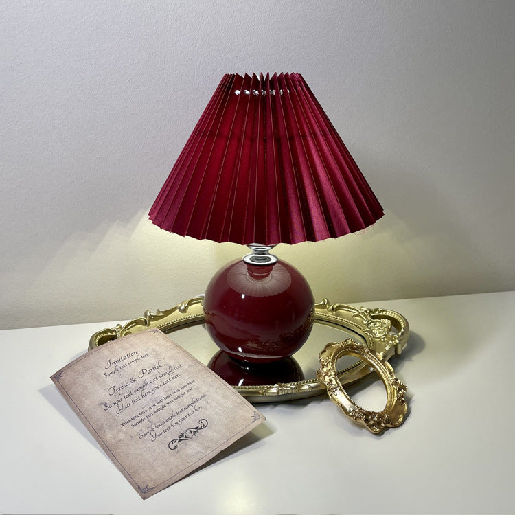 Modern Minimalist Round Fabric Pleated Ceramic 1-Light Table Lamp for Bedroom | Stylish Bedside Lighting | Contemporary Home Decor | Elegant Bedroom Accent | Soft Ambient Illumination | Decorative Lighting Fixture | Chic Fabric Shade | Ceramic Base Design