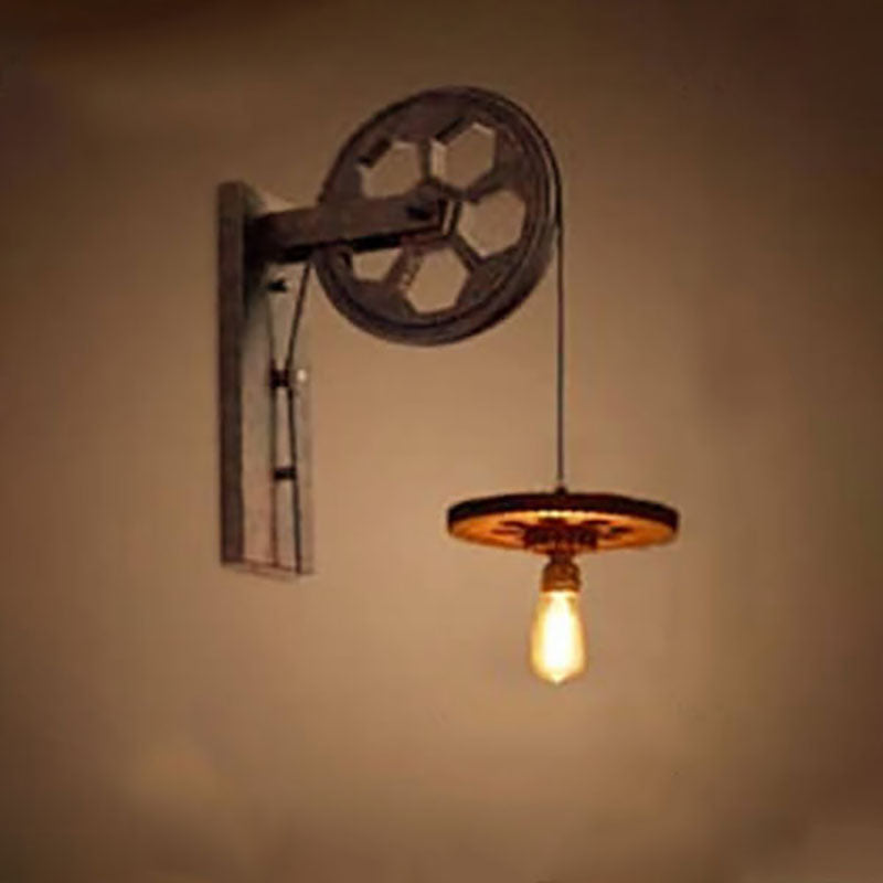 Vintage Industrial Iron Pulley Wall Sconce Lamp - 1-Light Fixture 

Elevate your home decor with this stylish vintage industrial pulley wall sconce. Crafted from durable iron, this 1-light lamp combines rustic charm with modern functionality. Perfect for