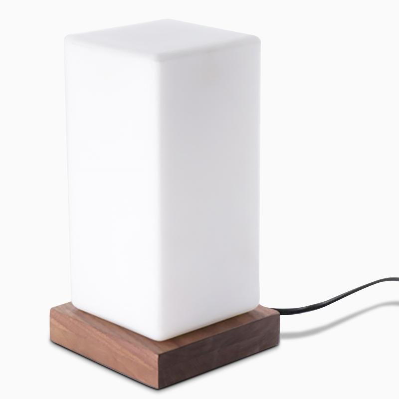 Title: Battery-Powered LED Wooden Cube Lamp

Description: Illuminate your space with our stylish Square Table Light. This Battery-Powered LED Wooden Cube Lamp combines modern design with warm ambiance, making it perfect for any room. Ideal for nightstands