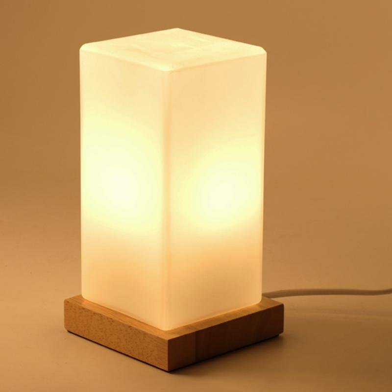 Title: Battery-Powered LED Wooden Cube Lamp

Description: Illuminate your space with our stylish Square Table Light. This Battery-Powered LED Wooden Cube Lamp combines modern design with warm ambiance, making it perfect for any room. Ideal for nightstands