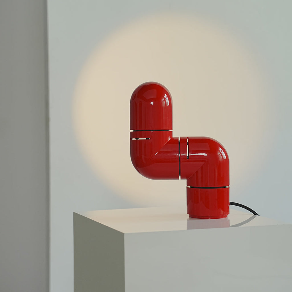 **Statement Table Lamp - Creative Pipe Modern Rotating Design**

**Product Description:**
Introducing our Statement Table Lamp, a unique blend of creativity and modern design. This eye-catching lamp features a striking pipe-inspired structure that not onl