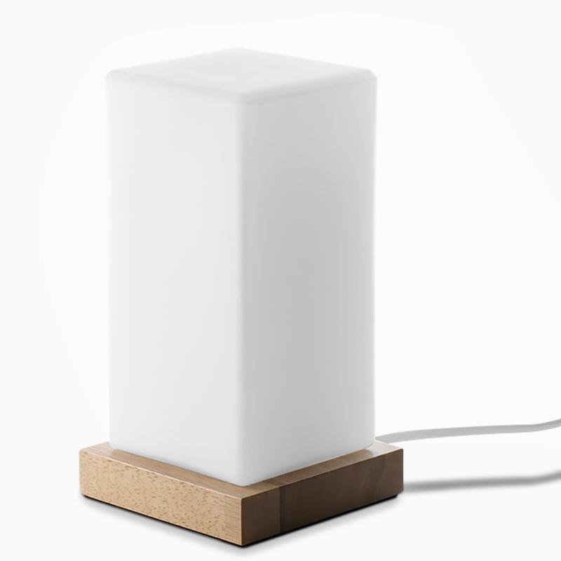 Title: Battery-Powered LED Wooden Cube Lamp

Description: Illuminate your space with our stylish Square Table Light. This Battery-Powered LED Wooden Cube Lamp combines modern design with warm ambiance, making it perfect for any room. Ideal for nightstands