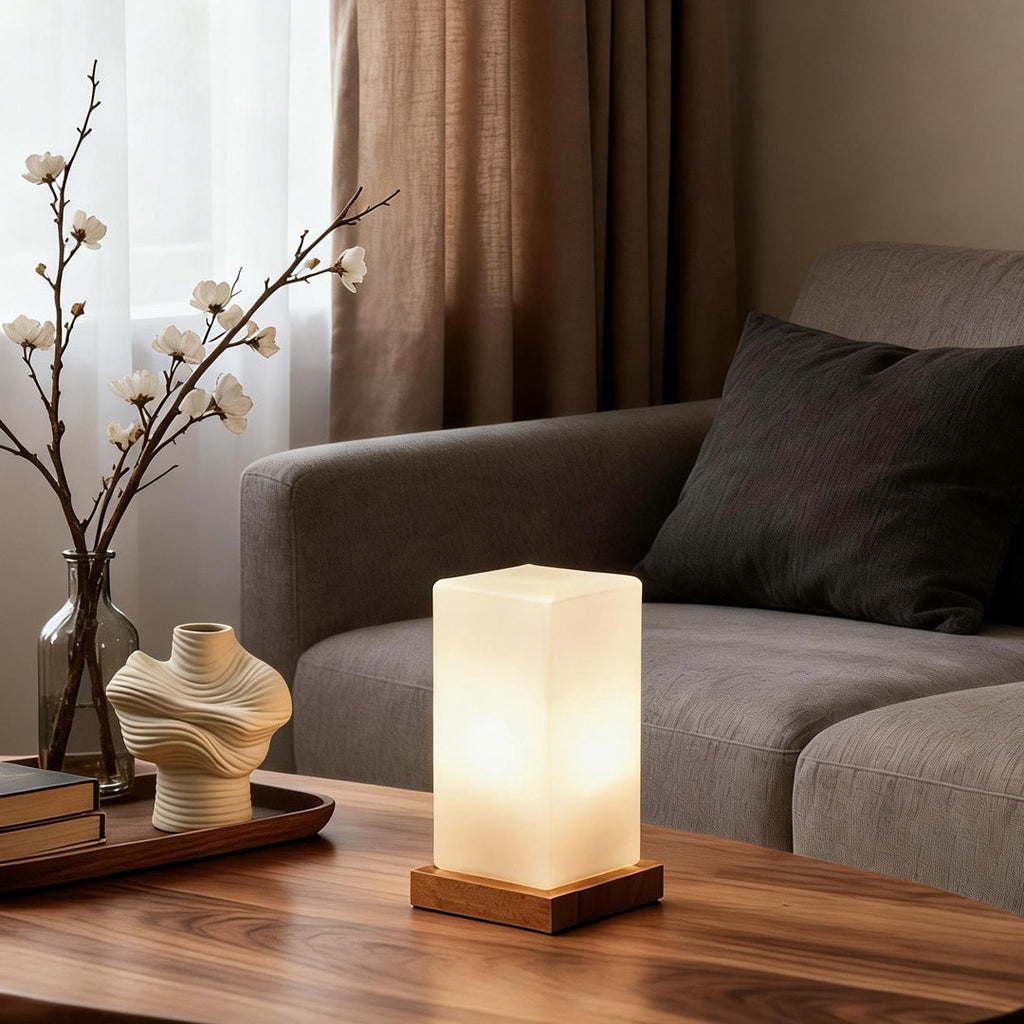 Title: Battery-Powered LED Wooden Cube Lamp

Description: Illuminate your space with our stylish Square Table Light. This Battery-Powered LED Wooden Cube Lamp combines modern design with warm ambiance, making it perfect for any room. Ideal for nightstands
