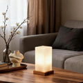 Title: Battery-Powered LED Wooden Cube Lamp

Description: Illuminate your space with our stylish Square Table Light. This Battery-Powered LED Wooden Cube Lamp combines modern design with warm ambiance, making it perfect for any room. Ideal for nightstands