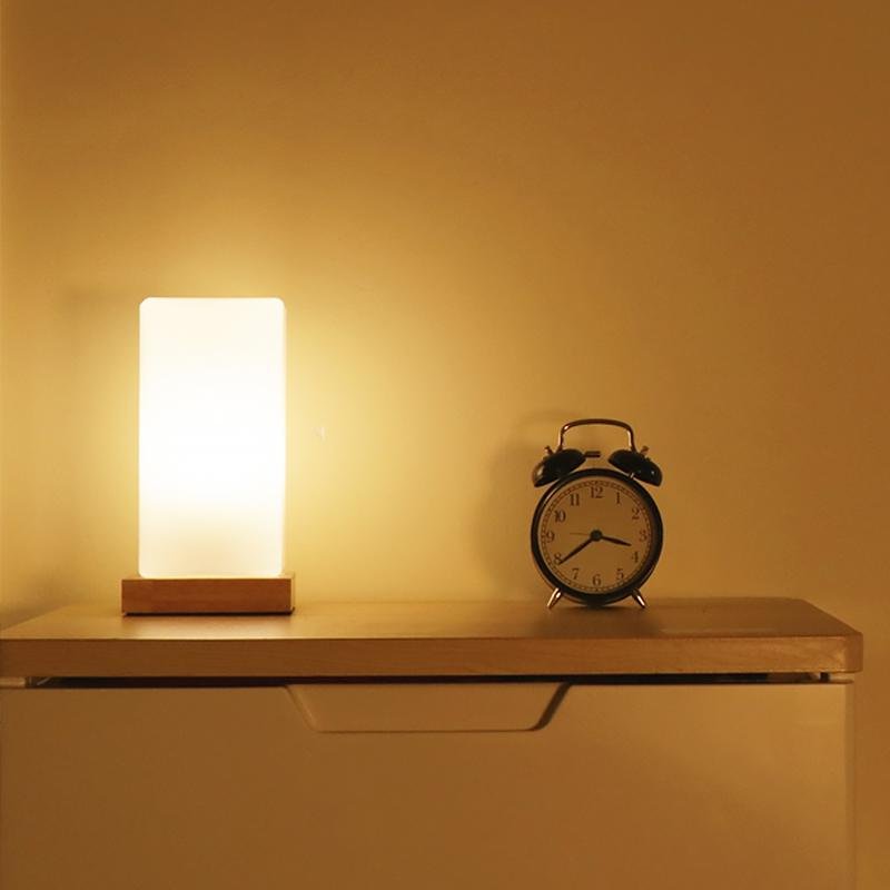 Title: Battery-Powered LED Wooden Cube Lamp

Description: Illuminate your space with our stylish Square Table Light. This Battery-Powered LED Wooden Cube Lamp combines modern design with warm ambiance, making it perfect for any room. Ideal for nightstands