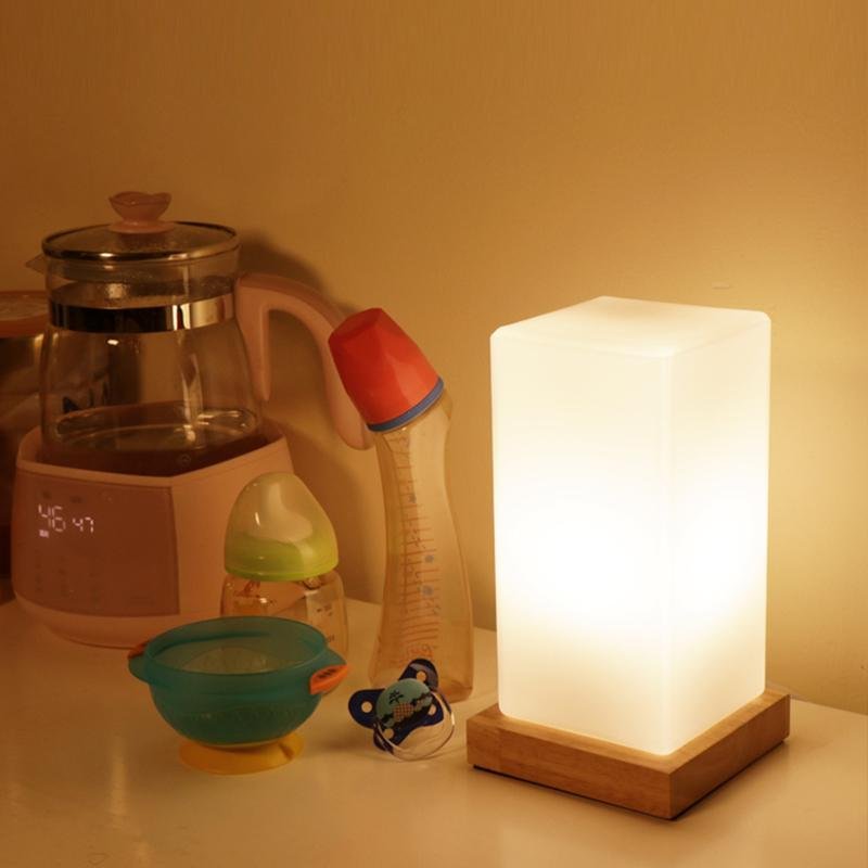 Title: Battery-Powered LED Wooden Cube Lamp

Description: Illuminate your space with our stylish Square Table Light. This Battery-Powered LED Wooden Cube Lamp combines modern design with warm ambiance, making it perfect for any room. Ideal for nightstands