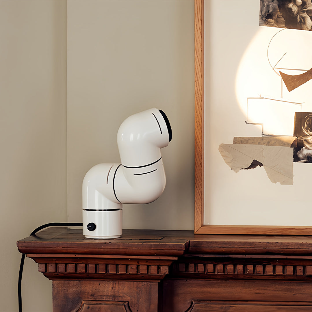 **Statement Table Lamp - Creative Pipe Modern Rotating Design**

**Product Description:**
Introducing our Statement Table Lamp, a unique blend of creativity and modern design. This eye-catching lamp features a striking pipe-inspired structure that not onl